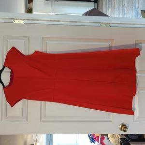 Orange, sleeveless, relaxed pleats, back zipper